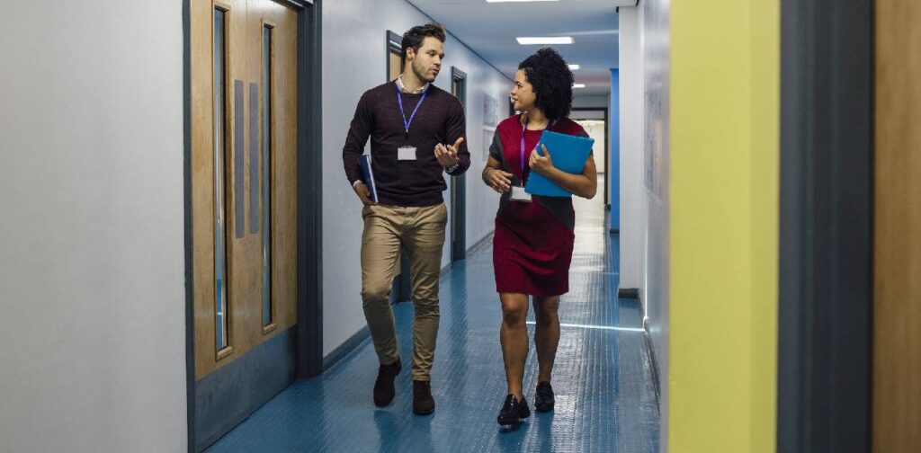 Male and female teachers In The school Hall